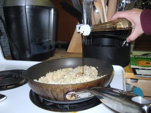 add soy sauce to rice in skillet